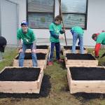 COMCAST COURTESY PHOTO                                A local Eagle Scout troop helps build Kinder Gardens for students at Central Park Elementary School.