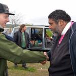 LOUIS KRAUSS | THE DAILY WORLD Rev. Dr. William Barber II meets with a homeless camper along the Chehalis River in Aberdeen. This was his last stop on a nationwide tour of select impoverished communities as part of the Poor Peoples Campaign.