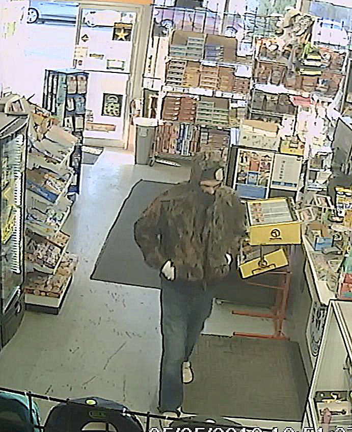 HOQUIAM POLICE DEPARTMENT                                Hoquiam Police are seeking this man, who was caught on video robbing the SmokeTown convenience store on Simpson Avenue Friday evening. Armed with a large black knife, the man was able to evade capture even after being confronted by an armed citizen as he attempted to pry open the stores cash drawer with the knife.