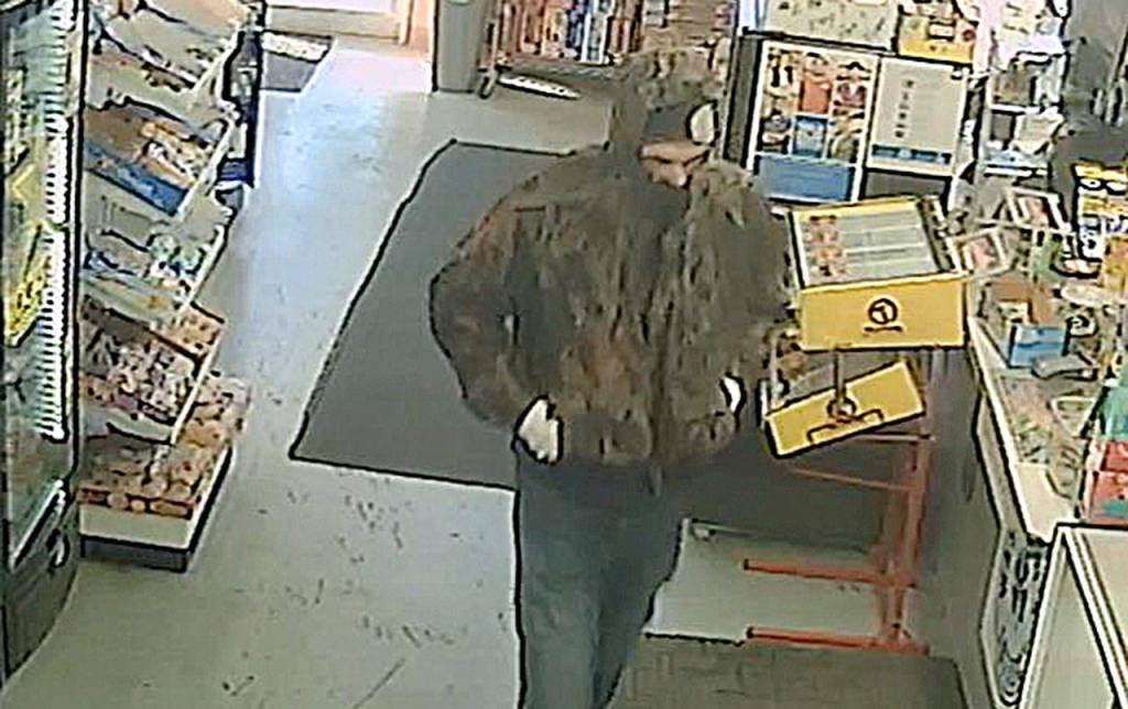 HOQUIAM POLICE DEPARTMENT                                Hoquiam Police are seeking this man, who was caught on video robbing the SmokeTown convenience store on Simpson Avenue Friday evening. Armed with a large black knife, the man was able to evade capture even after being confronted by an armed citizen as he attempted to pry open the stores cash drawer with the knife.