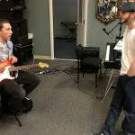 LOUIS KRAUSS | THE DAILY WORLD JR Lakey, right, director of The Garage: Music & Arts Center, gives advice to guitar student Chris Rondon at a jam session two weeks ago.