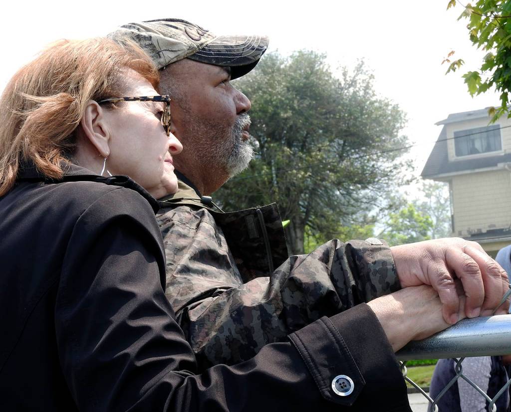 (Kat Bryant | The Daily World) Longtime museum volunteer Becky Carossino comforts Dave Morris, executive director of the Aberdeen Museum of History.