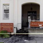 (Kat Bryant | The Daily World) The building entrance is littered with glass and charred bits.