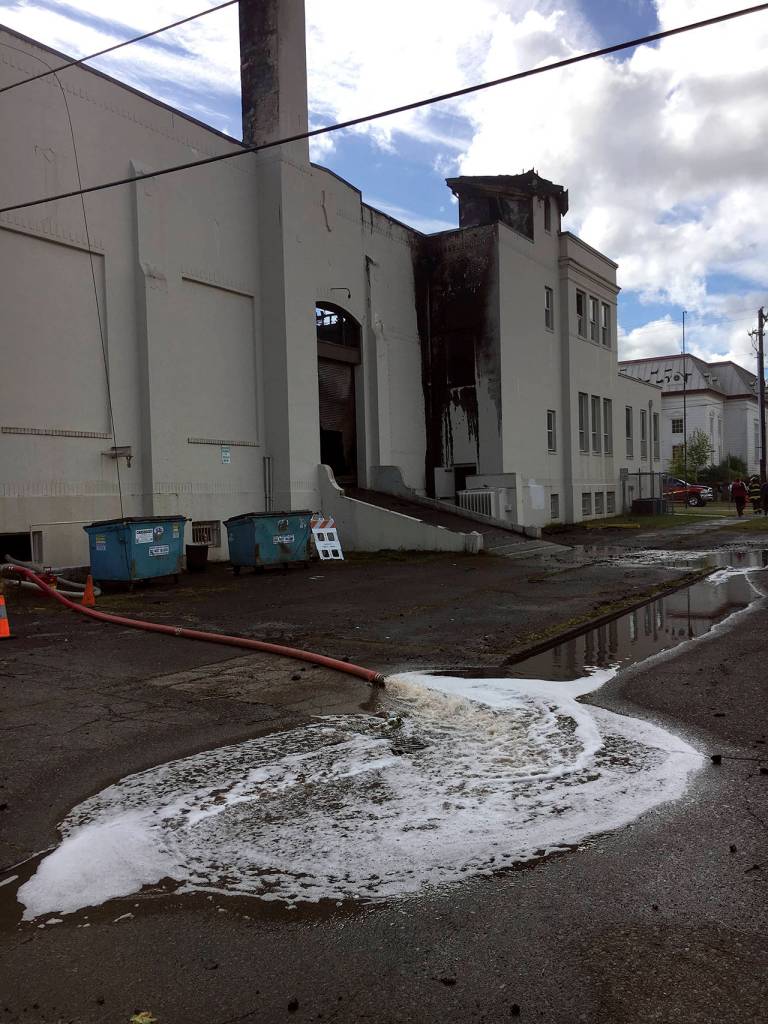 (Kat Bryant | The Daily World) Aberdeen Fire Department pumps water out of the Armory basement after the fire was put out.