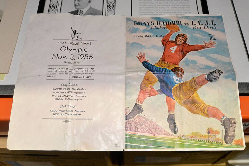 LOUIS KRAUSS | THE DAILY WORLD A flyer from 1956 advertises a home game for Grays Harbor Colleges football team against Lower Columbia Junior College. This document was cleaned and dried at the Washington State Archives warehouse in Tumwater.