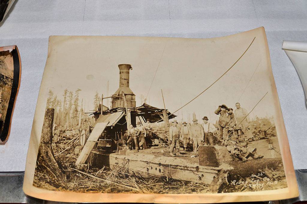 LOUIS KRAUSS | THE DAILY WORLD A photo of the River Log Company, taken by the Kinsey brothers who photographed much of the Pacific Northwest in the early 1900s.
