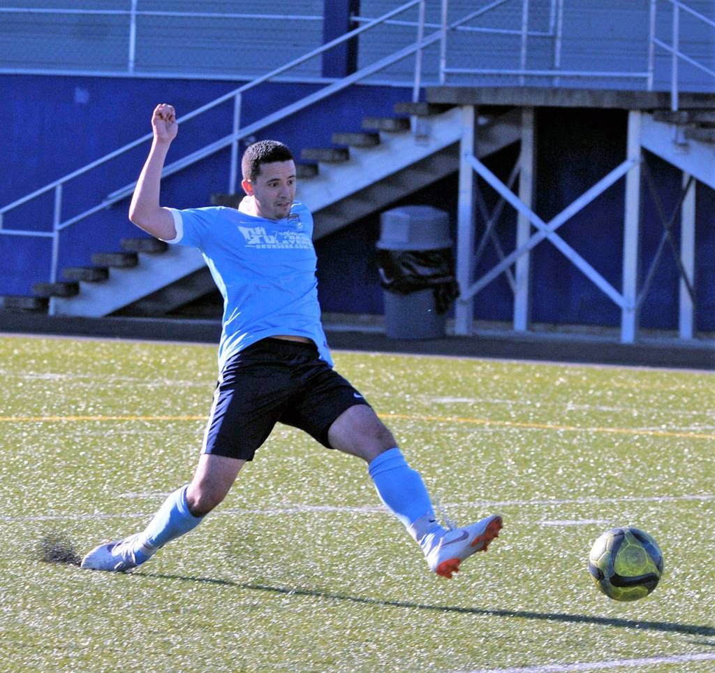Aaron Arias finishes a cross for a goal late in the second half of Grays Harbors 6-3 win over Federal Way on Saturday. (Hasani Grayson | The Daily World)