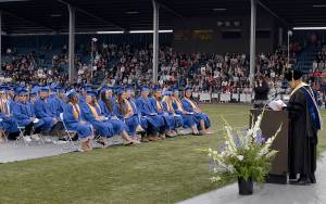 DAN HAMMOCK | THE DAILY WORLD                                Grays Harbor College president Dr. Jim Minkler addresses graduating students at Friday nights commencement ceremony at Stewart Field in Aberdeen.