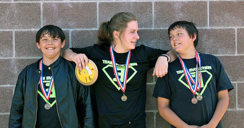 Karlee Freeman, middle, shares a laugh with twins Shaun Straka Jr., left, and Joseph Straka. (Photo courtesy of Team Evolution Athletics)