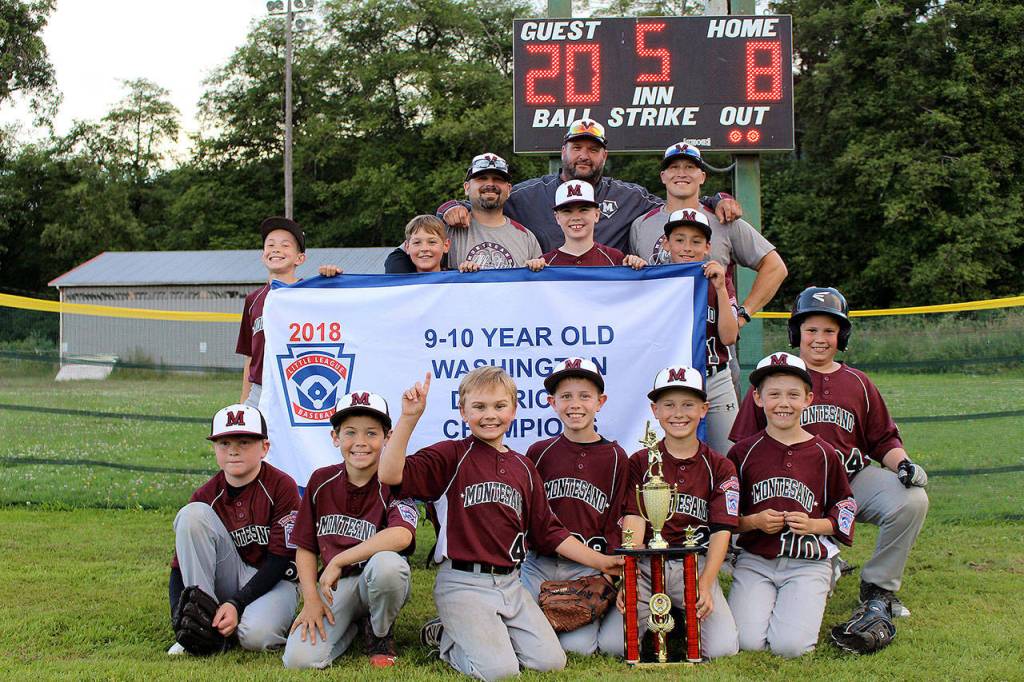 The Montesano 8-10 All-Star Team poses with their championship banner and trophy after defeating Centralia in the District 3 championship game on Friday. (Submitted photo)