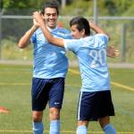 Victor Corona, left, celebrates with Victor Junco after Corona scored a goal in the first half against Twin City Union on Sunday. (Ryan Sparks | The Daily World)