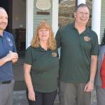 A visitor checks out a painting over the living fireplace during a tour of the Montesano Inn bed and breakfast. Above him are hand-painted Bavarian murals.                                Montesano Inn owners Pam and John Lansing.
