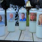 Candles honoring Gerald Fischman, Rob Hiassen, John McNamara, Rebecca Smith and Wendi Winters flicker as the sun sets during a candlelight vigil for the five Capital Gazette employees slain during a shooting spree in their newsroom. (Karl Merton Ferron/Baltimore Sun)