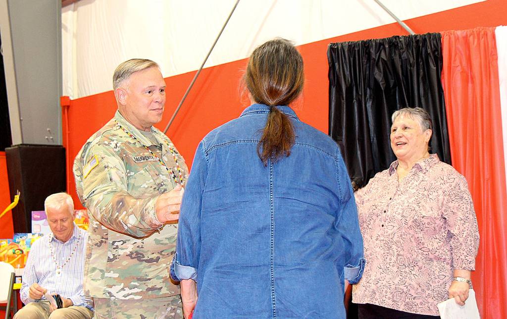 DAN HAMMOCK | THE DAILY WORLD                                Major General Bret Daugherty, State Adjutant General, received a hand-made necklace at the conclusion of the vertical tsunami evacuation tower event at the Shoalwater Bay gymnasium July 18. The $2.2 million federal grant was formally announced to build the structure near Tokeland.