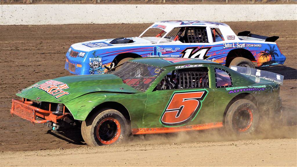Tom Hecker (5) races side-by-side with Jeff Daniel in a street stock class race on Saturday at Grays Harbor Raceway. (Photo by AR Racing Videos)