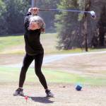 Britt Rajcich takes a tee shot a junior golf camp at Highland Golf Course. (Hasani Grayson | The Daily World)