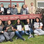 (Courtesy Tony Jennings) In the front row holding their new manuals, from left, are Willapa Harbor Sea Scouts Grecia Quintana, Alondra Rosas, Cynthia Orozco, Janeth Gutierrez and Yeni Silva, with unit leader Brian Sherman. In the back row, from left, are Jason Nelson, Sea Scout leader Manuel Rangel, Rod Bannish, Sea Scout leader Tim Quigg, Elks member Rick Smith, Sea Scout leader Gordon Chaffee and South Bend Superintendent Jon Tienhaara.