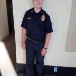 Courtesy photo                                Loric Colgrove proudly wears his uniform and badge as Hoquiams Chief for a Day.