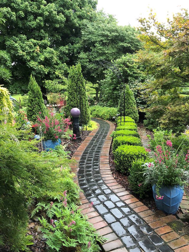 Boxwoods line a path in this Indiana garden. (Constance McAlpin)