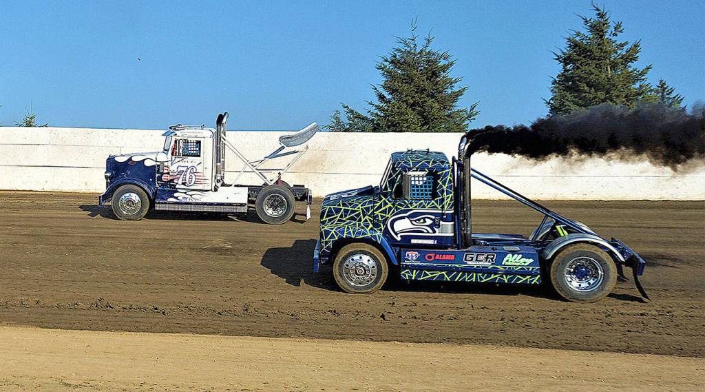 Leo Norris (76) and Jerome Burdick race around the Grays Harbor Raceway track in preparation for the Rolling Thunder Big Rigs race on Saturday in Elma. (Photo by AR Racing Videos)