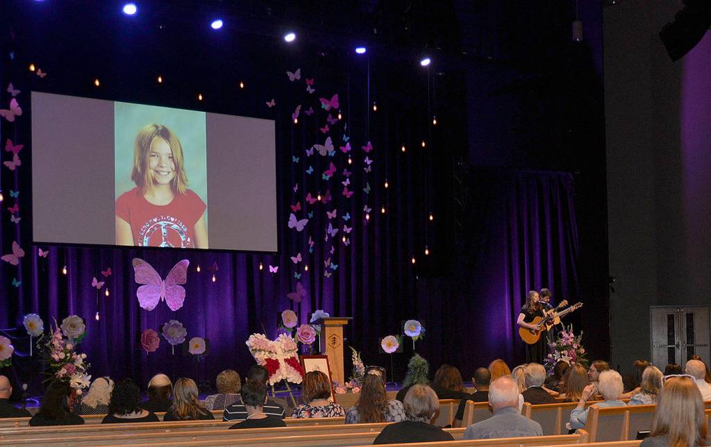 DAN HAMMOCK | THE DAILY WORLD                                Aberdeen singer/songwriter Ericka Corban performed at the Lindsey Baum memorial service in Olympia Saturday. Here she sings Eric Claptons Tears in Heaven accompanied on guitar by Dan Stone; later she played Amazing Grace.