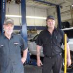 Harry Thayer, right, is training to take over the Whitneys Chevrolet tire shop in Montesano after Ron Belcher retires at the end of the month. Belcher ran the tire shop for 23 years. (Aug. 10, 2018)