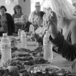 Louis Krauss | The Daily World                                Isaak McDonald, right, tries out the food at Thursdays United Way kickoff party that featured a cooking. McDonald was one of four judges.