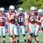 Montesano teammates congratulate Kai Olson (55) after making a tackle in the backfield at the Jamboree on Friday. (Hasani Grayson | The Daily World)