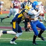 Aberdeens Jose Mercado, left, tackles Elmas Mikia Diacon at the jamboree on Friday in Montesano. (Hasani Grayson | The Daily World)