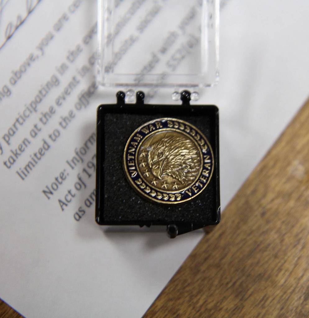 A 2008 law established the 50th anniversary commemoration of the Vietnam War by the U.S. Department of Defense. Part of that event is a lapel pin to be presented to Vietnam War veterans or their family members. The front of the pin reads Vietnam War Veteran. A Grateful Nation Thanks and Honors You is printed on the back side. Rep. Derek Kilmer visited Elma on Wednesday, Aug. 22, 2018, and handed out 63 of the pins. Photo by Michael Lang, The Vidette