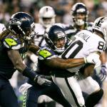 The Seattle Seahakws Dontae Johnson tackles the Oakland Raiders Saeed Blacknall (80) in preseason action at CenturyLink Field in Seattle on Thursday, Aug. 30, 2018. (Rebekah Welch/Seattle Times/TNS)