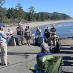 DAN HAMMOCK | THE DAILY WORLD                                Connie Allen, Washaway No More chairwoman (second from left) updates locals about the continued efforts to prevent shoreline erosion in the North Cove area at the end of old State Route 105 Monday afternoon. At left is David Cottrell, irrigation district board chairman.