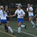 Elmas Kassedy Olson, left, celebrates her goal with Kayli Johnson in the 21st minute of a game against Aberdeen at Stewart field on Tuesday. (Hasani Grayson | The Daily World)
