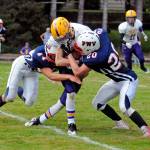 PWV defenders Kollin Jurek, left, and Sam Winter tackle Concrete receiver Devin Blankenship during the Titans 42-0 victory on Saturday in Menlo. (Ryan Sparks | The Daily World)