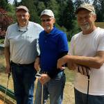 Ed Coyle, center, poses for a photo with Doug King, left, and Bob Smith after Coyle carded an ace on Wednesday at Highland Golf Course. (Submitted photo)