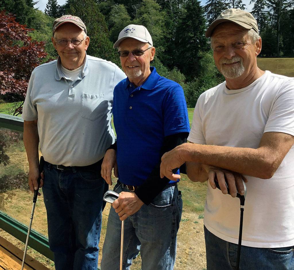 Ed Coyle, center, poses for a photo with Doug King, left, and Bob Smith after Coyle carded an ace on Wednesday at Highland Golf Course. (Submitted photo)
