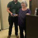 Louis Krauss | The Daily World                                Aberdeen Mayor Erik Larson presents an award to Alice Phelps as appreciation for her more than 19 years of service as a council member for the city.