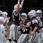 Montesanos Sam Winter leaps for joy and celebrates with his teammates after scoring a touchdown against Columbia-White Salmon on Friday. (Hasani Grayson | The Daily World)