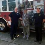 Photo courtesy Aberdeen Fire Department                                From left, Aberdeen Fire Department paramedic Colby Raffelson shakes hands with Gary Vaughan as Battalion Chief Damon Lillybridge looks on.