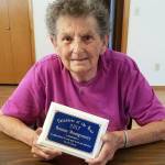 Bonnie Montgomery displays the Volunteer of the Year 2017 plaque awarded to her by the Town of Pe Ell in recognition of her tireless volunteer efforts in the community. (Kristi Milanowski | Twin Harbors Newspaper Group)