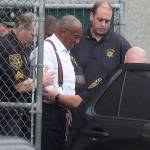 Entertainer Bill Cosby is escorted out in shackles from the Montgomery County courthouse in Norristown, Penn., on Tuesday. Cosby was sentenced to three to 10 years in prison. (David Maialetti/Philadelphia Inquirer)