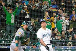 Mariners never matched Oakland’s second-half surge, so A’s celebrate playoff berth at Safeco Field