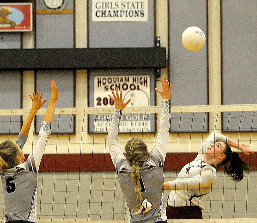 Hoquiams Elyse Goulet, right, comes up with the kill against Montesano on Tuesday. (Hasani Grayson | The Daily World)