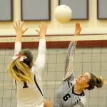 Montesanos Lindsay Pace, right, gets her shot past the block attempt of Hoquiams Janessa Otterstetter on Tuesday. (Hasani Grayson | The Daily World)