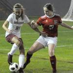 Montesanos Jaiden Morrison, left, and Hoquiams Katie Burnett battle for the ball along the sidelines in the second half at Olympic Stadium on Tuesday. (Hasani Grayson | The Daily World)