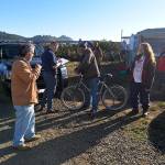 Louis Krauss | The Daily World                                A police officer takes notes as he speaks with people living at the major homeless encampment along the Chehalis River in Aberdeen.