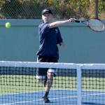 Aberdeens Brice Kola returns serve in a doubles match against Centralia on Wednesday at Sam Benn Park. (Hasani Grayson | The Daily World)
