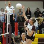 South Bends Karley Reidinger gets her shot over the net against Ocosta on Thursday at South Bend High School. Ocosta won the match 3-1. (Hasani Grayson | The Daily World)