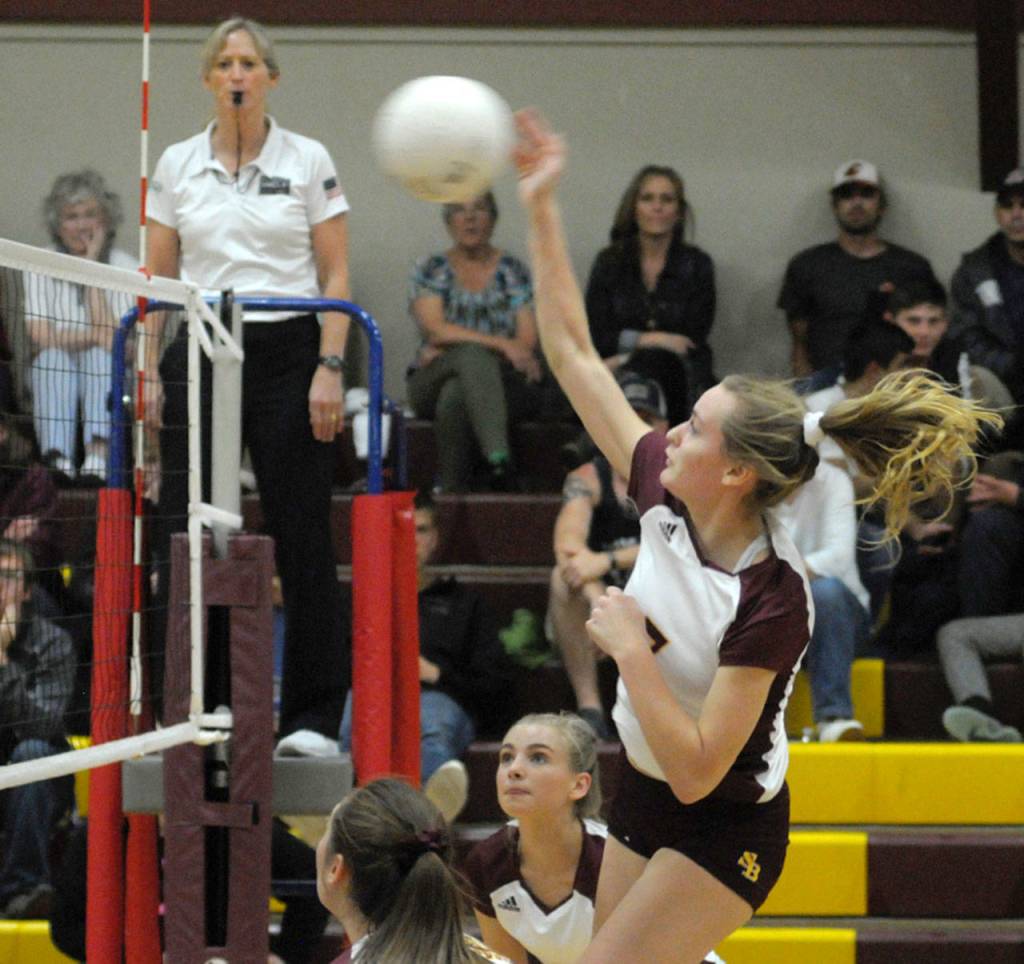 South Bends Karley Reidinger gets her shot over the net against Ocosta on Thursday at South Bend High School. Ocosta won the match 3-1. (Hasani Grayson | The Daily World)