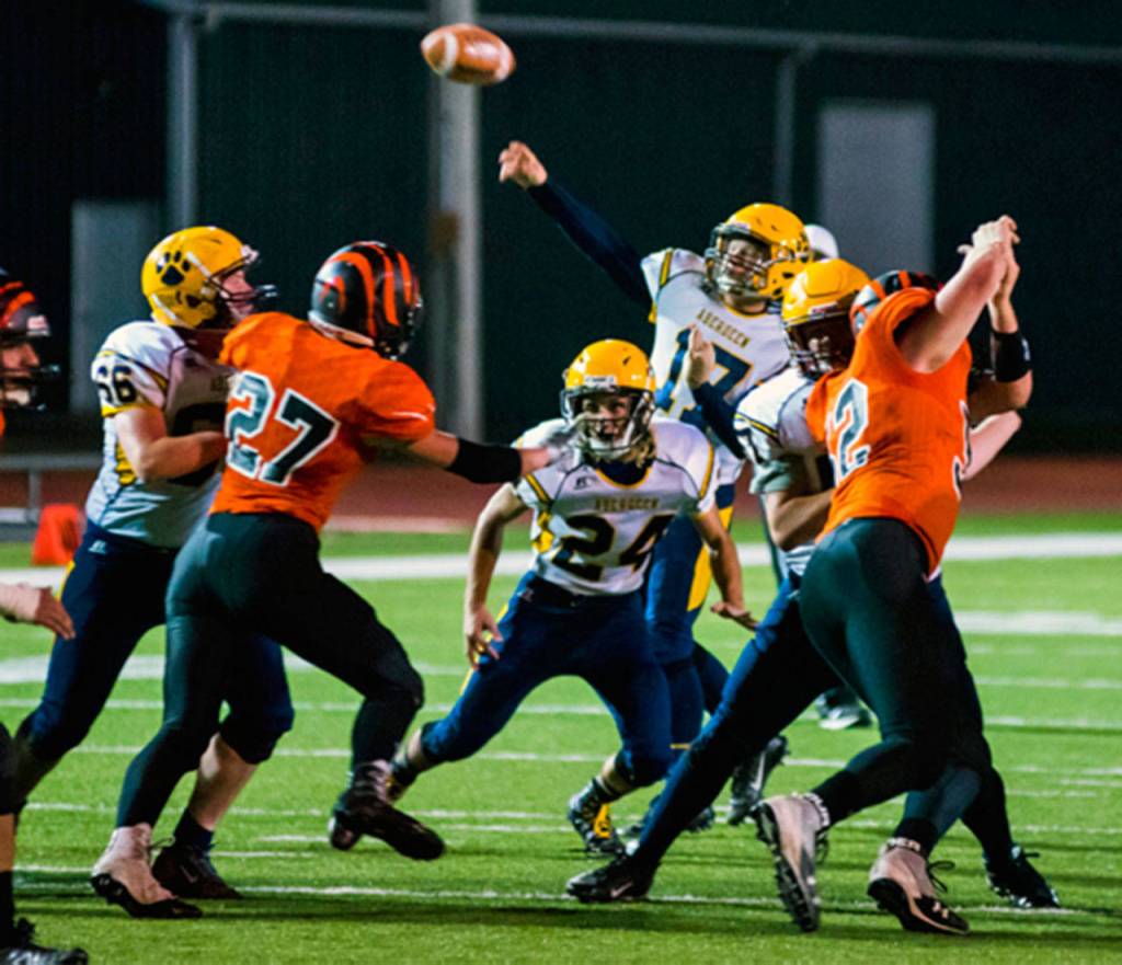 Aberdeen quarterback Ben Dublanko, background, throws a pass against Centralia on Friday. (Photo by Jared Wenzelburger | The Chronicle)
